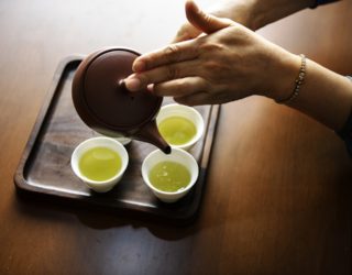 Green Tea poured into small oriental tea cups